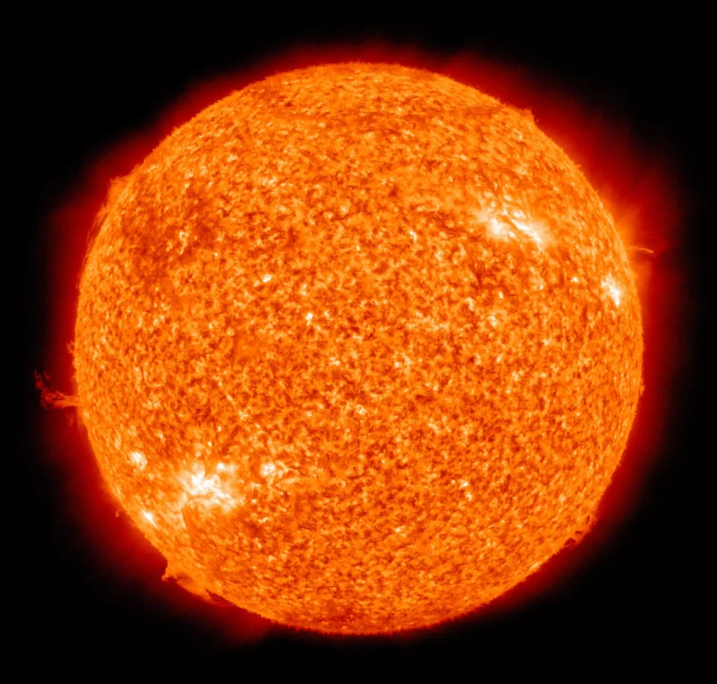 False-color ultraviolet image of the Sun captured by NASA’s Solar Dynamics Observatory, showing solar activity and prominences.