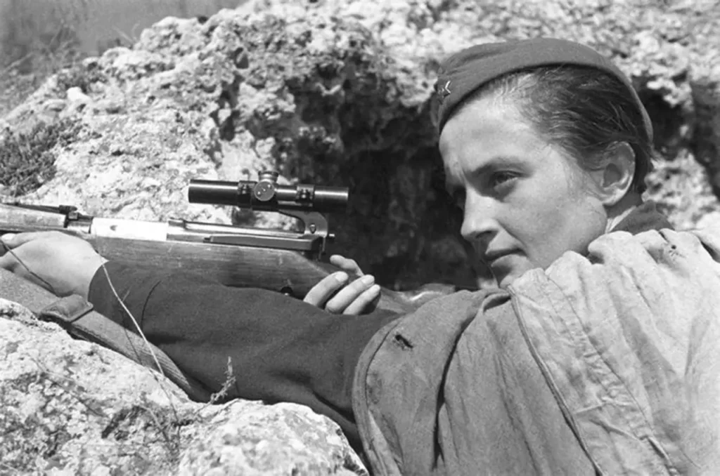 Lyudmila Pavlichenko Soviet female sniper aiming Mosin-Nagant rifle in trench World War II USSR women snipers