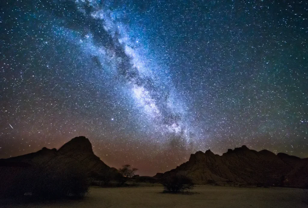 Milky Way shining above Spitzkoppe in Namibia, one of the darkest places on Earth and a perfect dark sky park for stargazing and night photography