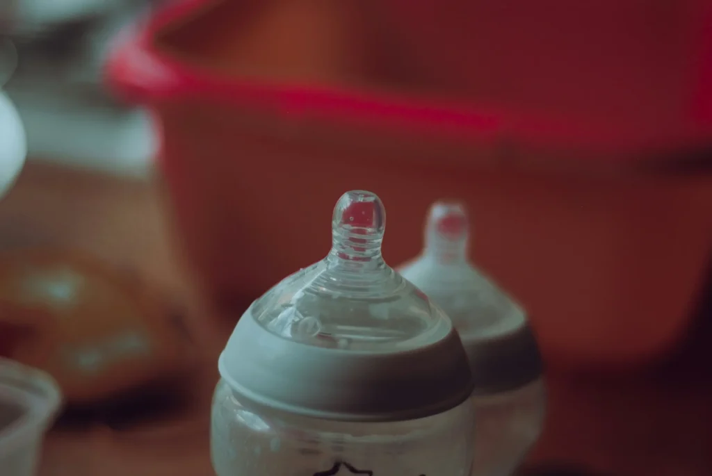 Baby feeding bottles symbolizing evidence in a child poisoning investigation