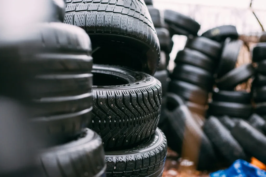 why are tires black pile of black car tires in storage